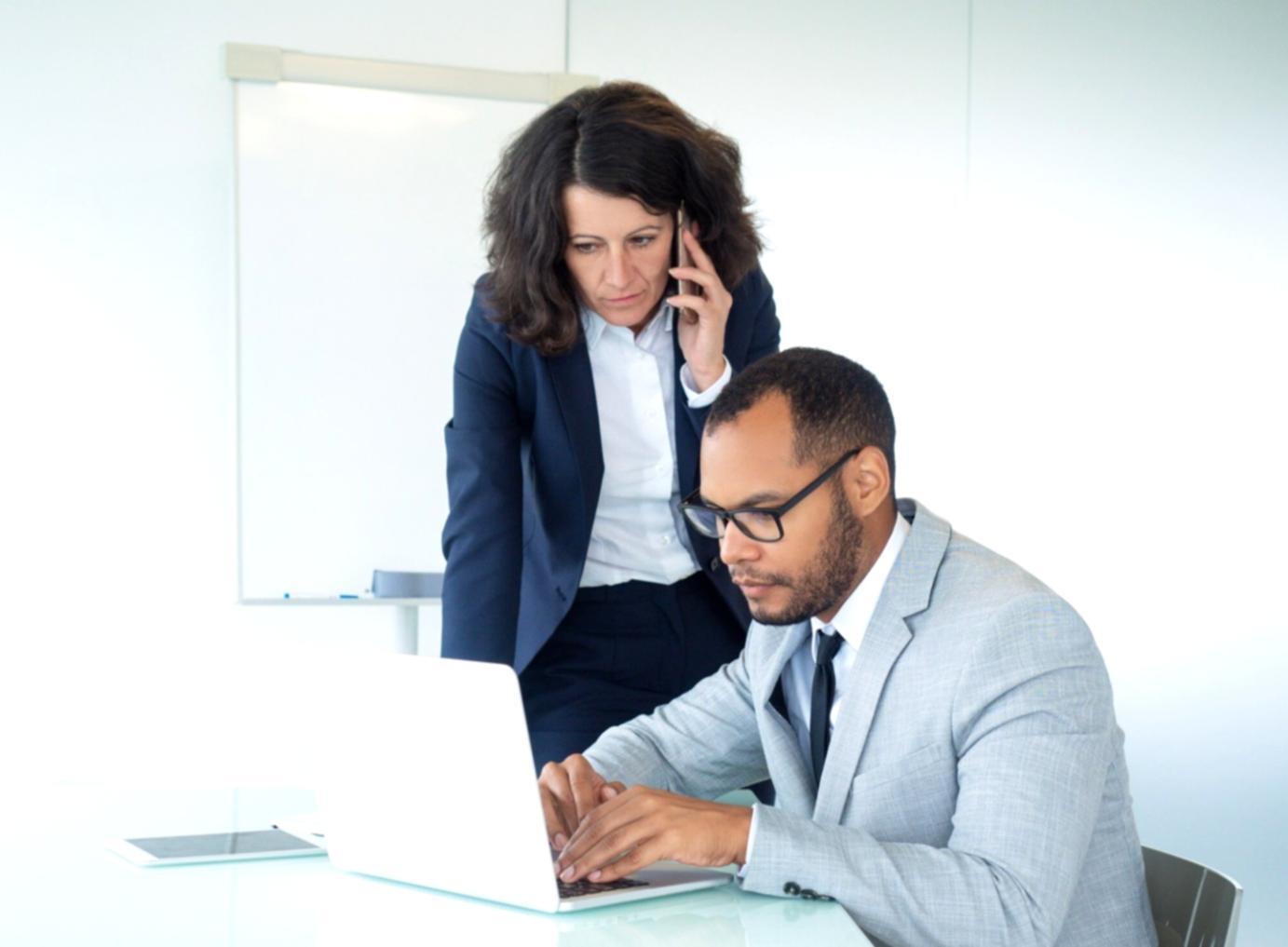 Modern financial data analysis workspace with multiple monitors displaying charts and graphs